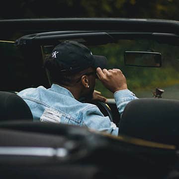 man sitting in a car